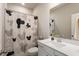 Bathroom featuring a modern vanity, decorative shower curtain, and tile flooring at 800 Mackay Crk, Woodstock, GA 30188