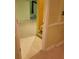 Basement room with tile floors, view of the stairs, and a partial view of an adjacent room at 9936 Point Vw, Jonesboro, GA 30238