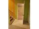 Stairs leading into the basement with a white door in an adjoining room and a view of the closet at 9936 Point Vw, Jonesboro, GA 30238