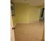Basement with pale yellow walls, tile flooring, and a framed zebra print on the wall at 9936 Point Vw, Jonesboro, GA 30238
