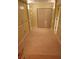 Unfinished basement with tan tile, recessed lights, and bi-fold doors to a closet at 9936 Point Vw, Jonesboro, GA 30238