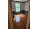 View of bedroom showcasing hardwood floors, with a window at 9936 Point Vw, Jonesboro, GA 30238