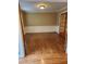 Dining room featuring rich hardwood flooring, modern wall paneling, and a transom door at 9936 Point Vw, Jonesboro, GA 30238