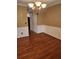 Formal dining area boasting wooden floors, wainscoting, and a chandelier at 9936 Point Vw, Jonesboro, GA 30238