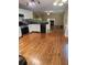 Kitchen with stainless steel appliances, white cabinets, and hardwood floors at 9936 Point Vw, Jonesboro, GA 30238