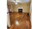 Open living room with hardwood floors, fireplace, and natural light at 9936 Point Vw, Jonesboro, GA 30238