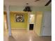 Inviting living room featuring tiled floors, decorative columns, and an open view into the bathroom at 9936 Point Vw, Jonesboro, GA 30238
