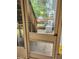 Enclosed patio featuring an entry door and outdoor stairs leading to the landscaped backyard at 9936 Point Vw, Jonesboro, GA 30238