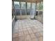 Spacious sunroom with tiled floors, large windows offering natural light and backyard views at 9936 Point Vw, Jonesboro, GA 30238