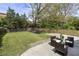 Inviting backyard with a lush lawn and mature trees providing ample shade at 1272 Hardee Ne St, Atlanta, GA 30307