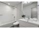 Updated bathroom featuring tub with white tiled walls, sink vanity, and modern fixtures at 1272 Hardee Ne St, Atlanta, GA 30307