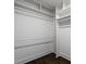 Walk-in closet with wood floors and open shelving for ample storage and organization at 1272 Hardee Ne St, Atlanta, GA 30307