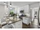 Bright kitchen showcasing white cabinets, stainless steel appliances, and granite countertops at 1272 Hardee Ne St, Atlanta, GA 30307
