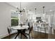 Bright kitchen with a large window, granite countertops, stainless steel appliances, and a modern light fixture at 1272 Hardee Ne St, Atlanta, GA 30307