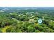 Aerial view showcasing the property's location in a densely wooded area near a neighborhood at 6470 Sherwood Trl, Austell, GA 30168