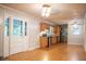 Open-concept kitchen and dining area with hardwood floors and stainless steel appliances at 6470 Sherwood Trl, Austell, GA 30168