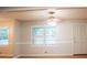 Bright living room featuring natural light, neutral walls, and classic molding details at 6470 Sherwood Trl, Austell, GA 30168