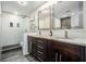 Modern bathroom featuring a double vanity with marble countertop and glass-enclosed shower at 8 Alston Ne Pl, Atlanta, GA 30324