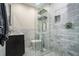 Well-lit bathroom features a modern vanity, glass-enclosed shower, and decorative tile at 8 Alston Ne Pl, Atlanta, GA 30324