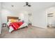 Bright bedroom with hardwood bed frame, ensuite bathroom, soft carpet and ceiling fan at 8 Alston Ne Pl, Atlanta, GA 30324