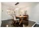 Dining room with wood table, upholstered chairs, and decorative lighting at 8 Alston Ne Pl, Atlanta, GA 30324