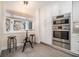 Kitchen features stainless steel appliances, white cabinets, and a window eating nook at 8 Alston Ne Pl, Atlanta, GA 30324