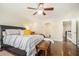 Spacious main bedroom with a ceiling fan, hardwood floors, and ensuite bathroom at 8 Alston Ne Pl, Atlanta, GA 30324