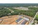 Aerial view of a new residential community surrounded by lush trees and a clear sky at 161 Stanchion Dr, Union City, GA 30291