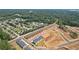 Aerial view of a residential community near lush foliage, featuring new construction homes at 161 Stanchion Dr, Union City, GA 30291