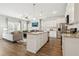 Open floor plan view of kitchen with stainless appliances and island flowing to living room with fireplace at 161 Stanchion Dr, Union City, GA 30291