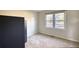 Bright bedroom with natural light from a window, and neutral carpet at 26 Loyd Cemetery Rd, Newborn, GA 30056