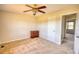 Bedroom with ceiling fan, carpet and view to hallway and outdoor trees at 26 Loyd Cemetery Rd, Newborn, GA 30056