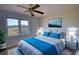 Bedroom with ceiling fan, a window, and blue accents at 26 Loyd Cemetery Rd, Newborn, GA 30056