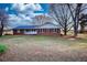 Cozy brick house with black shutters and a well-maintained lawn at 26 Loyd Cemetery Rd, Newborn, GA 30056