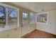 Bright sunroom featuring multiple windows and a door to the backyard at 26 Loyd Cemetery Rd, Newborn, GA 30056