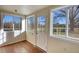 Sunroom with wood-look flooring and a door to the backyard at 26 Loyd Cemetery Rd, Newborn, GA 30056