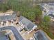 Aerial view of townhomes showing surrounding community with mature trees and landscaping at 28 Eagle Glen Ne Dr, Cartersville, GA 30121