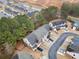 An aerial view of townhomes showing surrounding community with mature trees and landscaping at 28 Eagle Glen Ne Dr, Cartersville, GA 30121