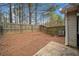 A fenced backyard with a concrete patio and a view of the trees at 28 Eagle Glen Ne Dr, Cartersville, GA 30121