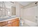 Bathroom features shower-tub combo, white tile, and a light-wood vanity cabinet at 28 Eagle Glen Ne Dr, Cartersville, GA 30121