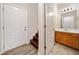 Convenient half bathroom featuring tile flooring and a wood vanity at 28 Eagle Glen Ne Dr, Cartersville, GA 30121