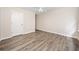 A bright bedroom with neutral paint and light-colored wood-look flooring at 28 Eagle Glen Ne Dr, Cartersville, GA 30121