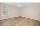 A bright bedroom featuring wood-look floors and a ceiling fan at 28 Eagle Glen Ne Dr, Cartersville, GA 30121