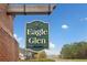 Eagle Glen community entrance sign with brick pillars and timber frame against blue sky at 28 Eagle Glen Ne Dr, Cartersville, GA 30121