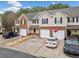 Shot of the exterior elevation of townhomes featuring attached garages and private driveways at 28 Eagle Glen Ne Dr, Cartersville, GA 30121