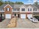 Exterior view of townhomes showing garages, driveways, and brick and vinyl siding at 28 Eagle Glen Ne Dr, Cartersville, GA 30121