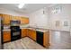 Charming kitchen with wooden cabinetry, stainless steel appliances, and wood-look flooring at 28 Eagle Glen Ne Dr, Cartersville, GA 30121