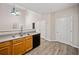 Eat-in kitchen with wooden cabinetry, stainless steel appliances, and wood-look flooring at 28 Eagle Glen Ne Dr, Cartersville, GA 30121