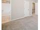 Bedroom featuring neutral carpet and an attached bathroom with tiled floors and a shower at 407 Paper Mill Lndg, Roswell, GA 30076