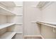 Walk-in closet with shelving and racks, offering ample storage space for clothes and accessories at 407 Paper Mill Lndg, Roswell, GA 30076